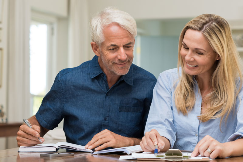 dental implants patient calculating the cost of procedure